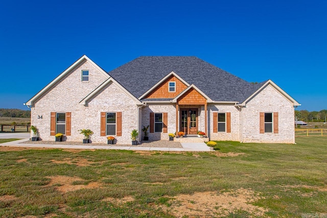 view of front facade with a front lawn and a patio