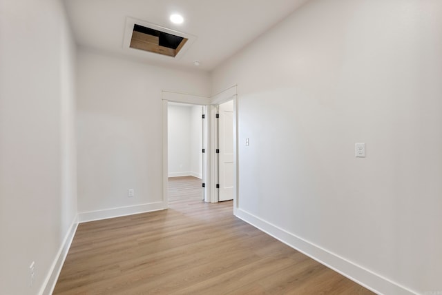 corridor with light wood-type flooring