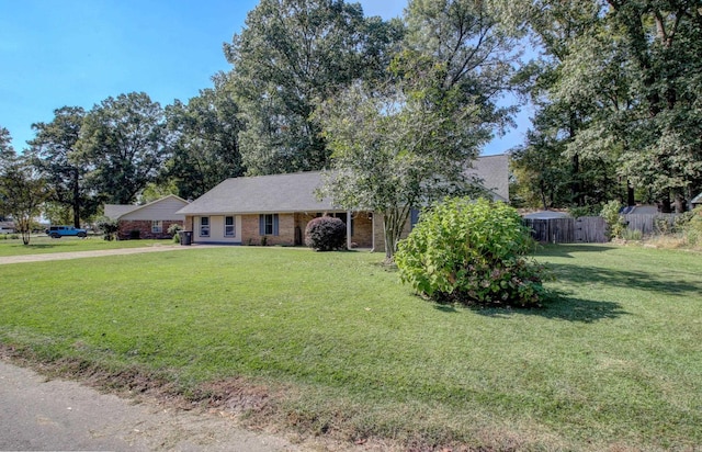 single story home featuring a front lawn