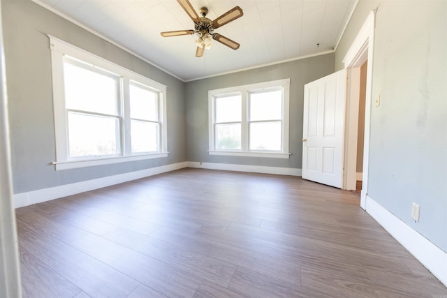 unfurnished room featuring ceiling fan, ornamental molding, and light hardwood / wood-style floors