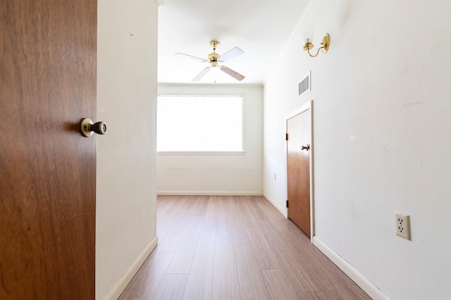 hall with light wood-type flooring