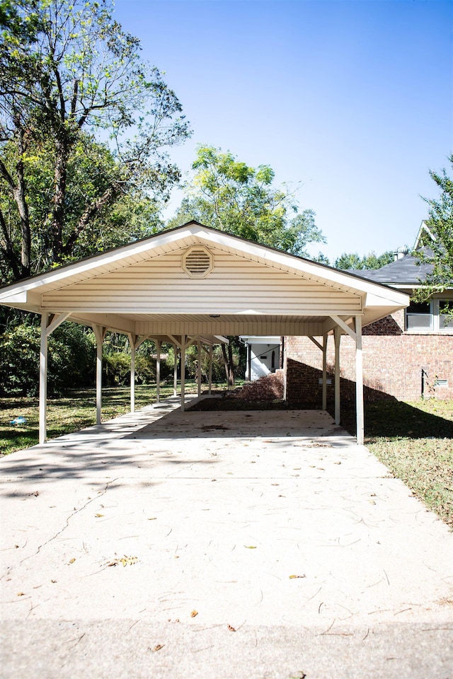 view of vehicle parking featuring a carport