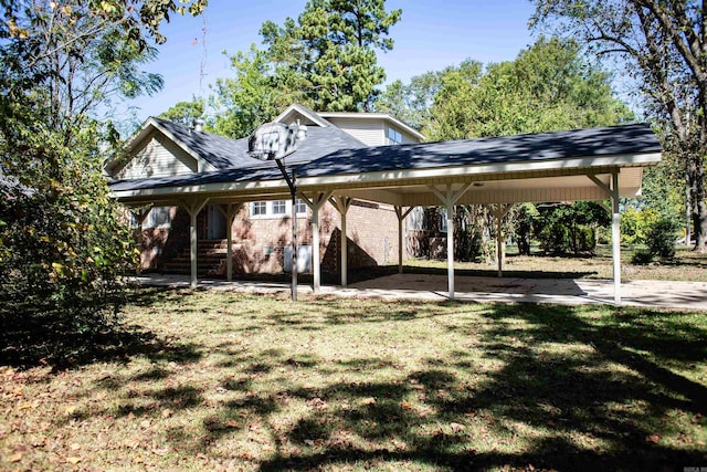 exterior space featuring a carport and a front yard