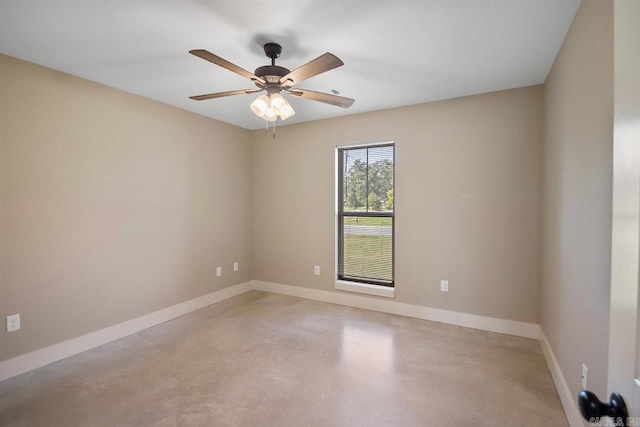 empty room featuring concrete floors and ceiling fan