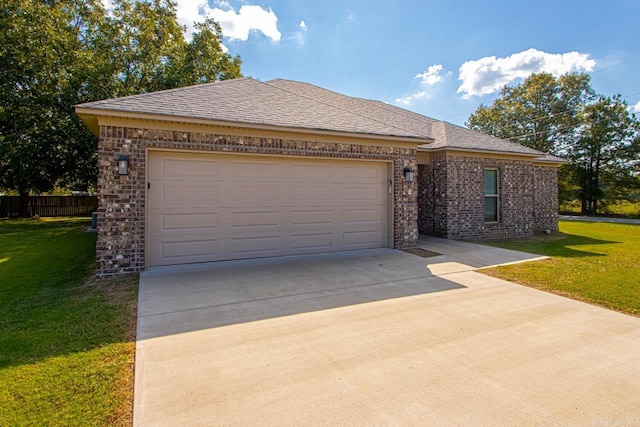 view of front of house with a garage and a front yard