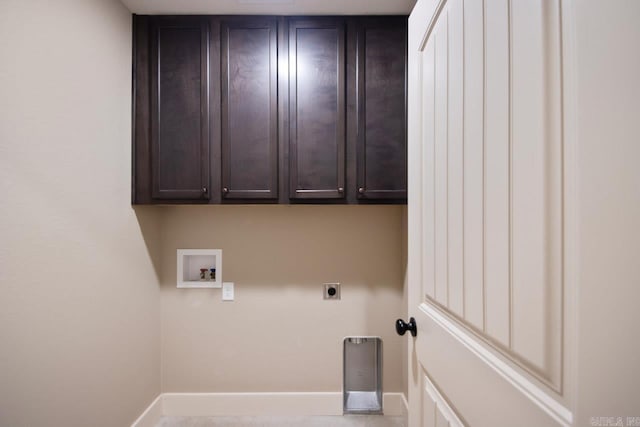 laundry room with hookup for a washing machine, hookup for an electric dryer, and cabinets