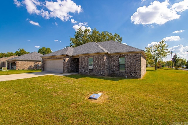 single story home featuring a garage and a front yard