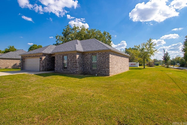 view of front of home featuring a garage and a front lawn