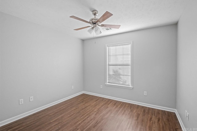 unfurnished room featuring hardwood / wood-style flooring, ceiling fan, and a textured ceiling