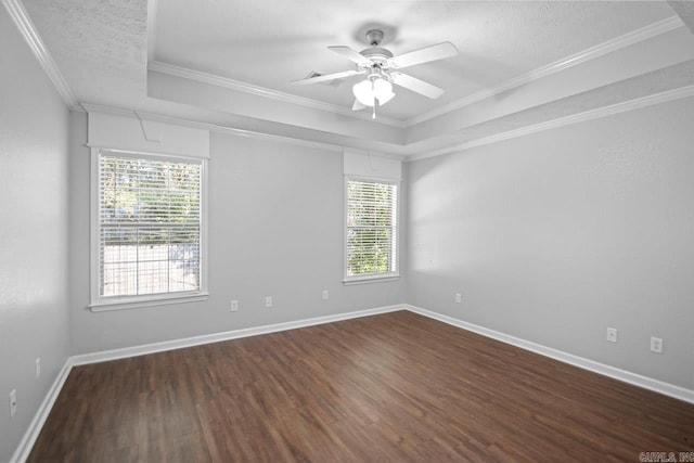 unfurnished room with ceiling fan, dark hardwood / wood-style floors, crown molding, and a healthy amount of sunlight