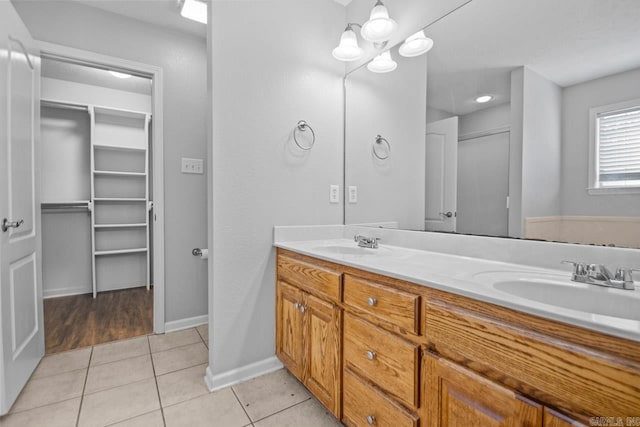 bathroom with tile patterned floors and vanity