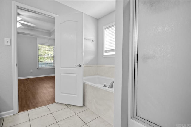 bathroom featuring tile patterned floors, ceiling fan, and independent shower and bath