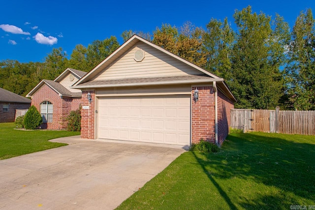 view of front of home featuring a front yard and a garage