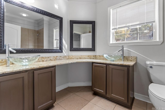 bathroom featuring crown molding, toilet, tile patterned flooring, and vanity