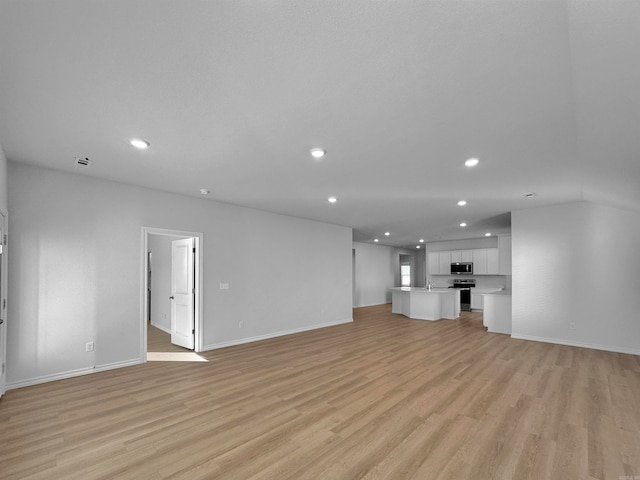 unfurnished living room featuring light wood-type flooring