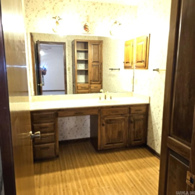 bathroom featuring vanity and hardwood / wood-style floors