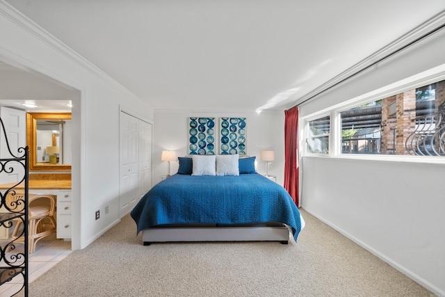 carpeted bedroom featuring crown molding and a closet