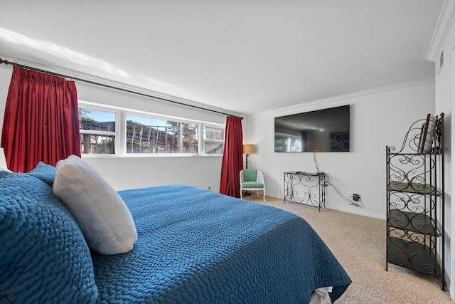 bedroom featuring ornamental molding and light carpet