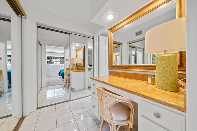 bathroom with vanity, crown molding, and tile patterned floors