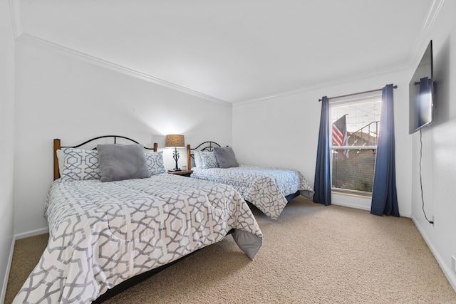 carpeted bedroom featuring crown molding