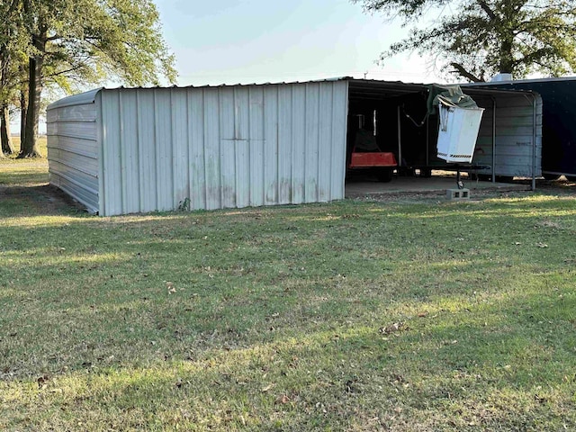 view of outdoor structure with a yard