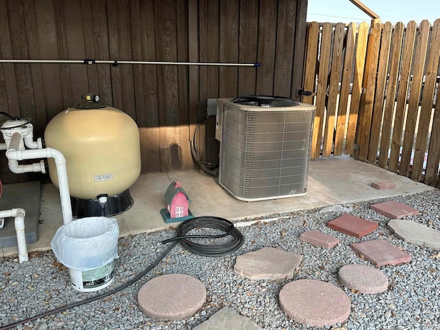 exterior details with central AC unit and wood walls