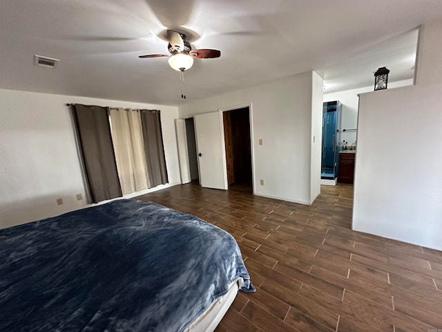 bedroom featuring ceiling fan and dark hardwood / wood-style floors