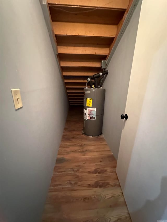 utility room featuring water heater