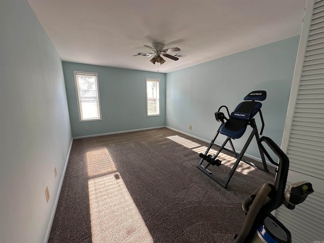 exercise room with carpet floors and ceiling fan