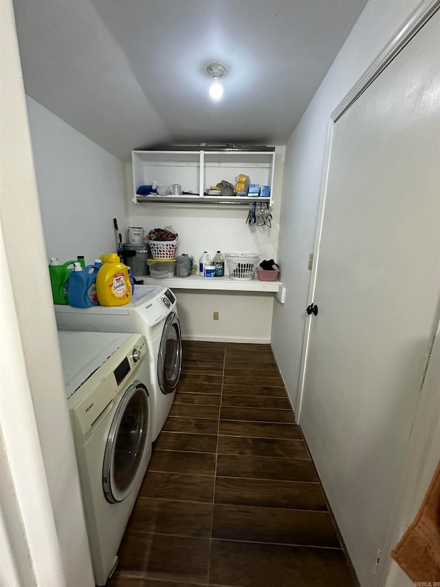 clothes washing area featuring washing machine and dryer and dark hardwood / wood-style flooring