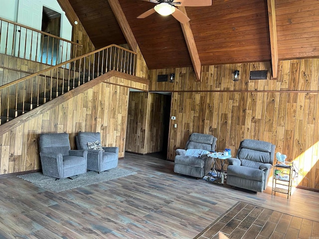 unfurnished living room with hardwood / wood-style floors and beam ceiling