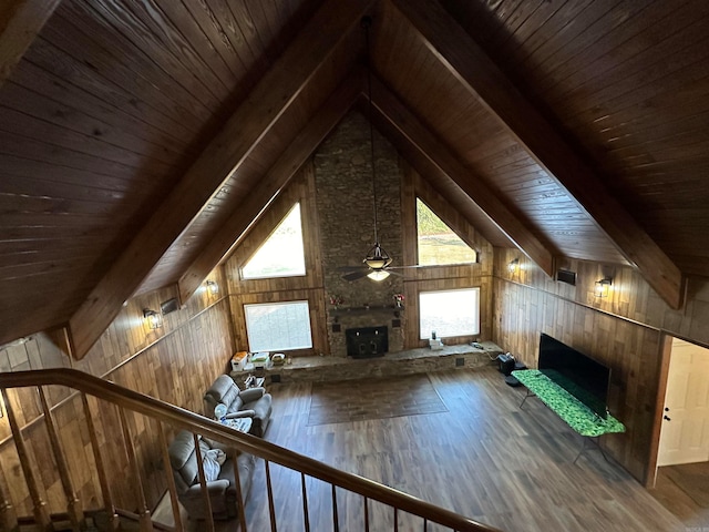 additional living space featuring ceiling fan, hardwood / wood-style flooring, wooden walls, and wooden ceiling