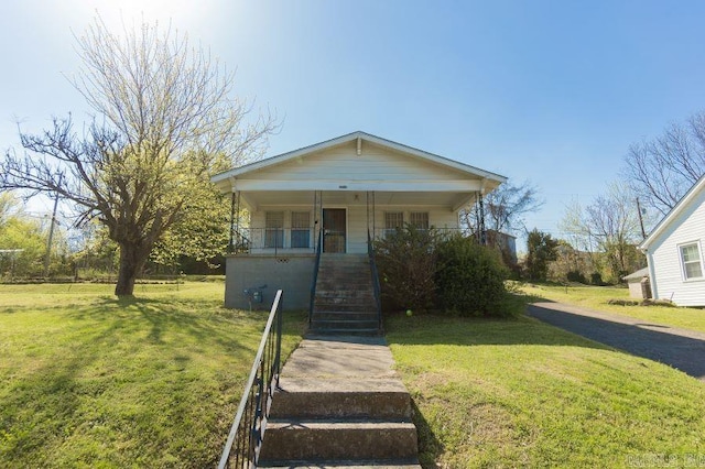 view of front facade with a porch and a front yard