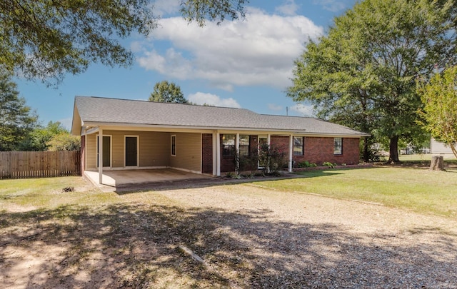 back of property featuring a patio and a yard