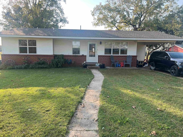 ranch-style house with a carport and a front yard