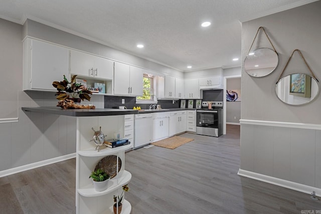 kitchen with white dishwasher, white cabinetry, hardwood / wood-style floors, and stainless steel electric range