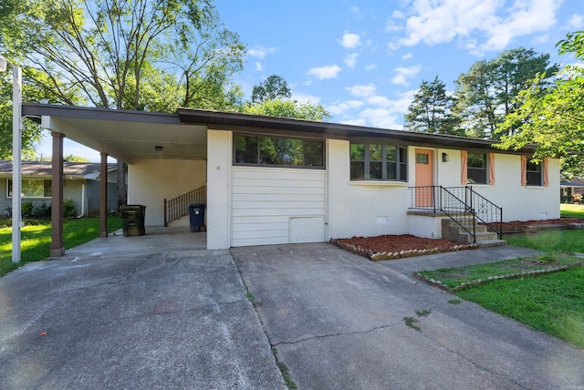 single story home with a front yard and a carport