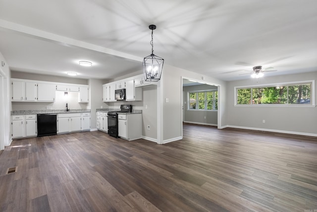 kitchen with white cabinets, hanging light fixtures, dark hardwood / wood-style floors, and black appliances