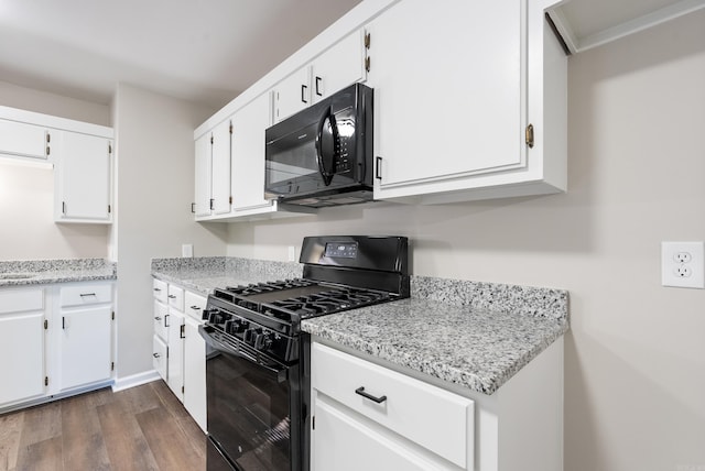 kitchen with white cabinets, dark hardwood / wood-style flooring, and black appliances