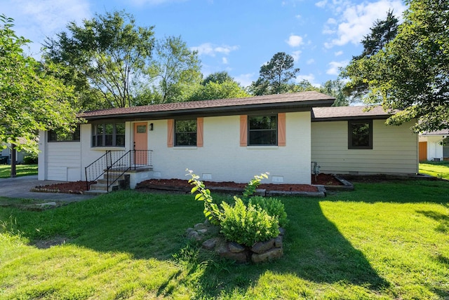 single story home with a front yard