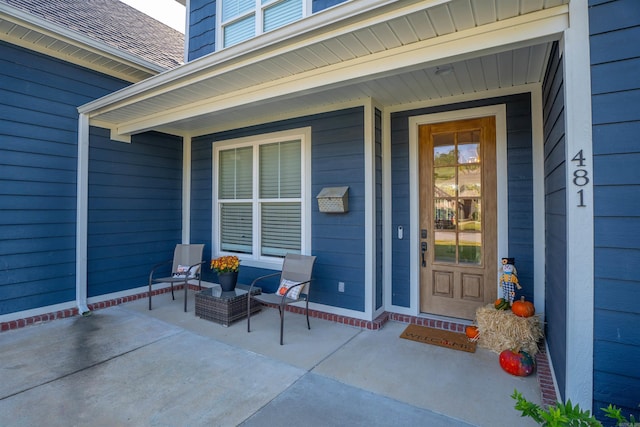 entrance to property featuring covered porch