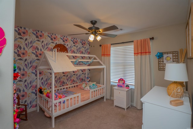 bedroom with ceiling fan and light carpet