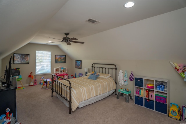 carpeted bedroom with vaulted ceiling and ceiling fan