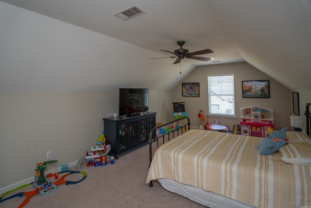 carpeted bedroom with vaulted ceiling and ceiling fan