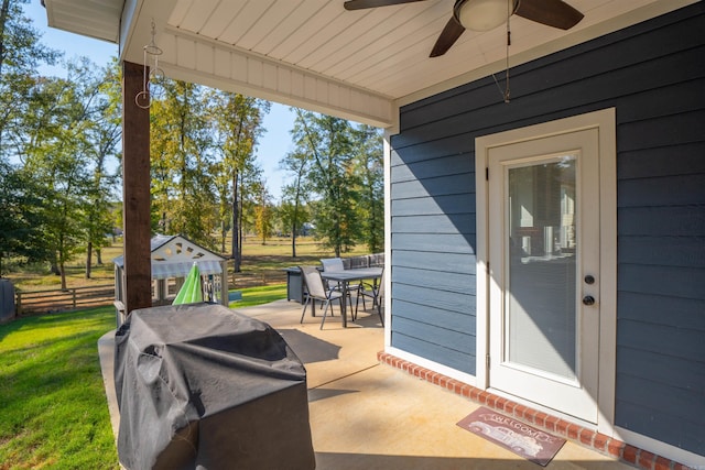 view of patio with ceiling fan and grilling area