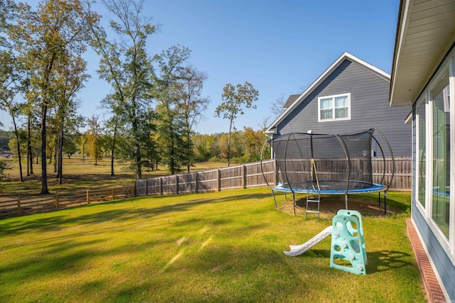 view of yard with a trampoline