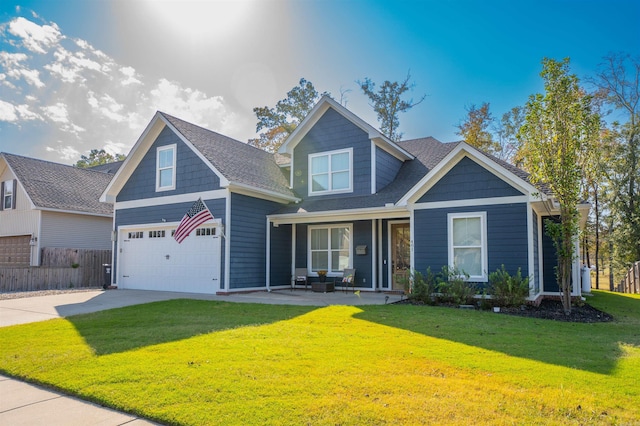 craftsman-style house with a front yard and a garage