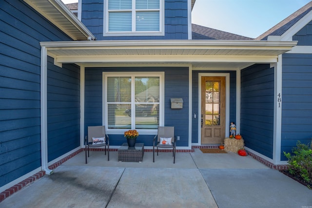 property entrance featuring covered porch