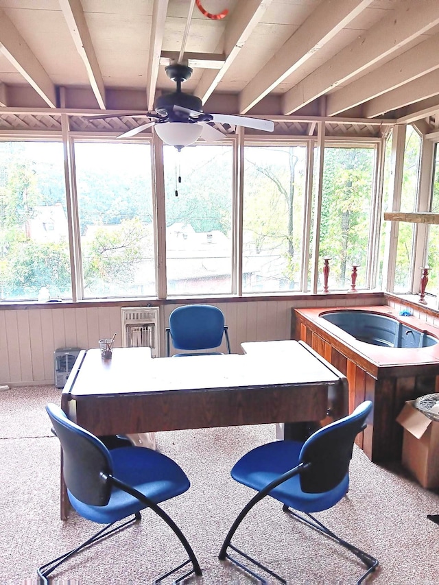 sunroom / solarium with ceiling fan and a hot tub