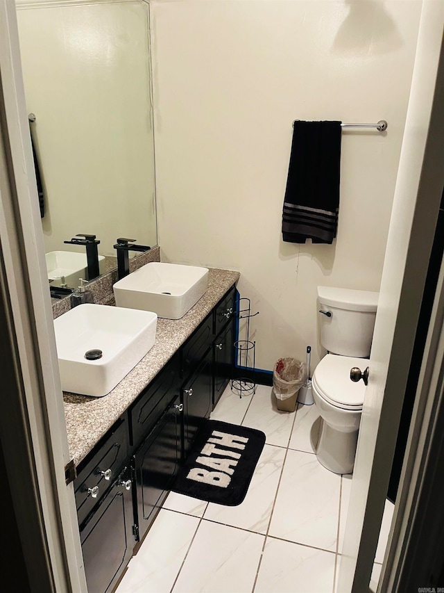 bathroom with toilet and vanity